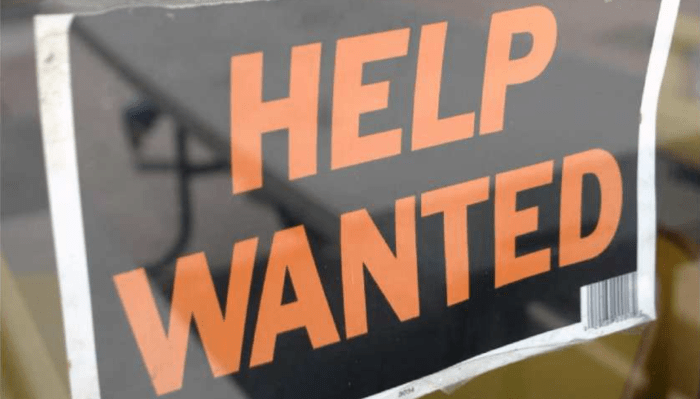help wanted sign in a store window