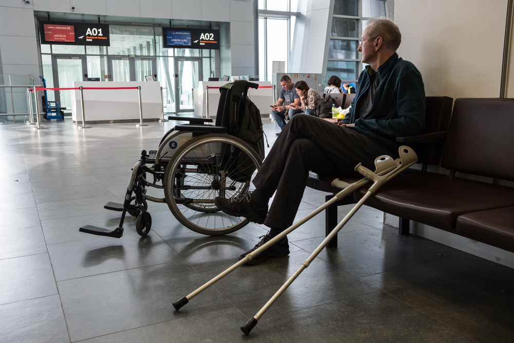 elderly disabled person at Pulkovo airport in a wheelchair